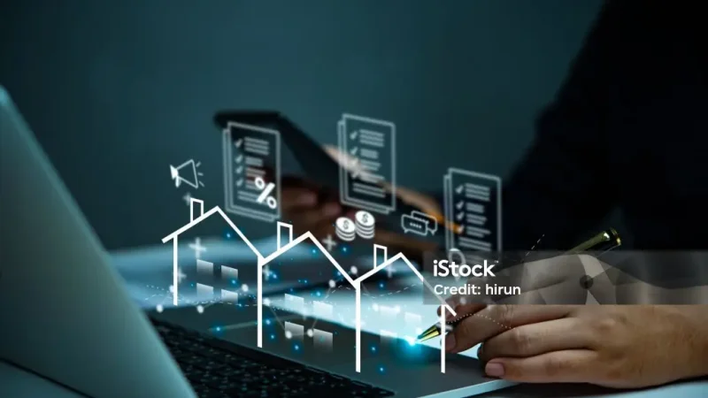 Businessman holding virtual graph showing real estate market growth. Perfect for financial, real estate, and investment presentations. Property market analysis concept.